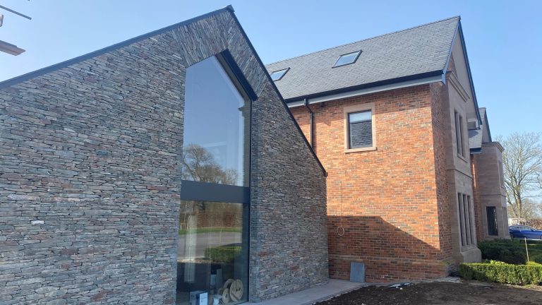 Slate wall with tall glass window